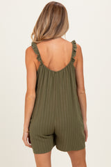 woman wearing an olive green pinstriped maternity romper with ruffle straps and a relaxed fit, showing the back view
