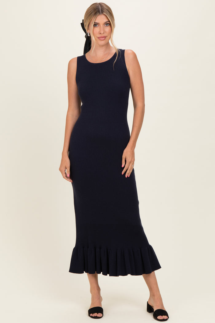 woman wearing a navy ribbed midi dress with a flared hem and sleeveless design