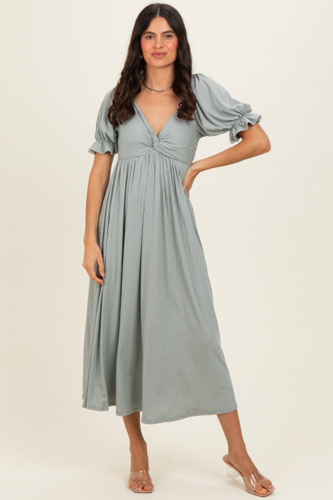 woman wearing a light grey puff sleeve midi dress with a v-neck and gathered detail