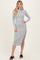 woman wearing a gray ribbed turtleneck midi dress with a side slit and long sleeves