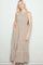 woman wearing a sleeveless floral maxi dress with a tiered hem and side pockets