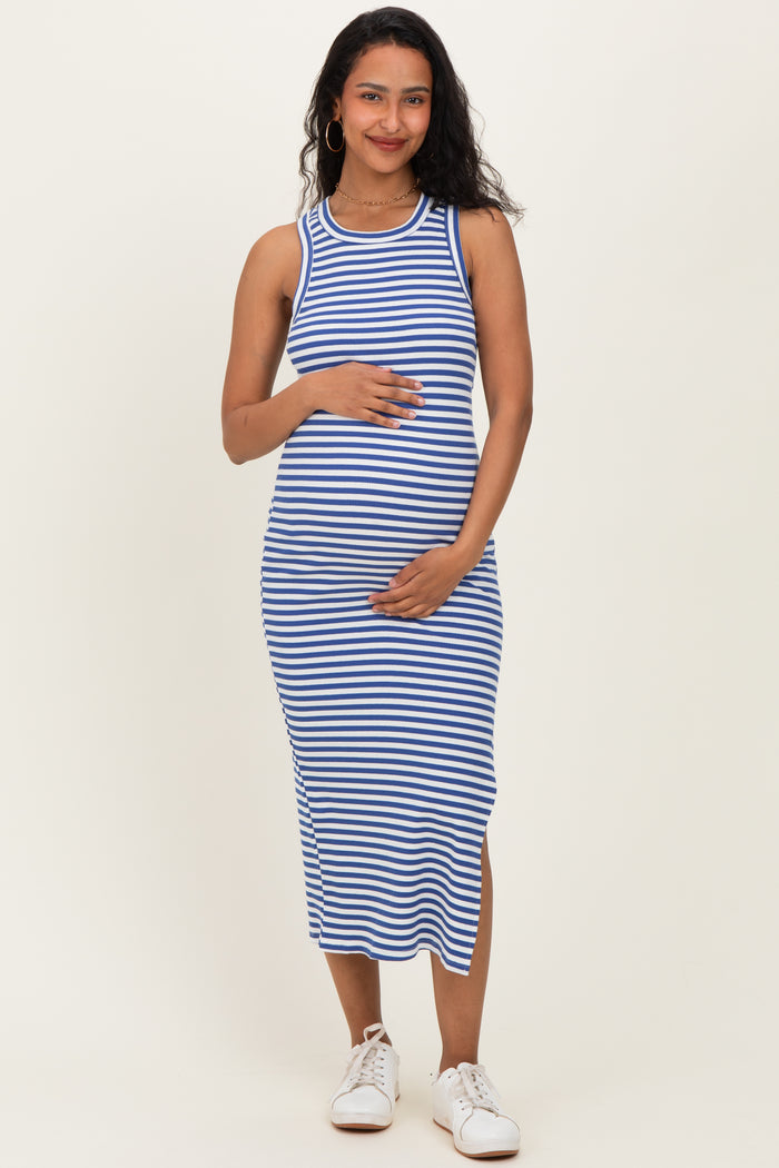 woman wearing a blue and white striped maternity dress with a fitted style and holding her baby bump