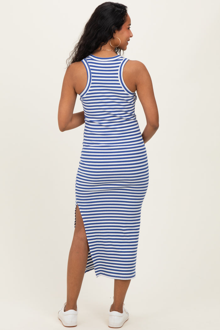 woman wearing a blue and white striped maternity maxi dress with a side slit, showing her baby bump from the back