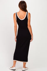 woman wearing a black sleeveless maxi dress with cream trim details, showing the back view