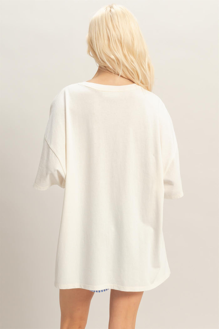 woman wearing an oversized white t-shirt viewed from the back