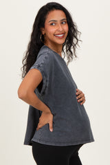 woman wearing a dark gray oversized maternity T-shirt and holding her baby bump