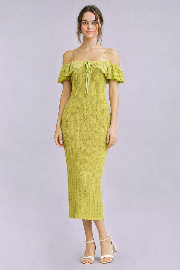 woman wearing a light green off-shoulder ribbed midi dress with ruffle details and a tie at the neckline