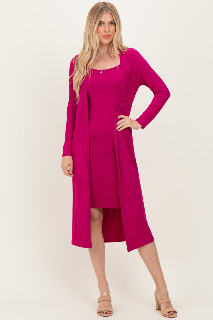 woman wearing a hot pink ribbed dress with a matching long cardigan and nude heeled sandals