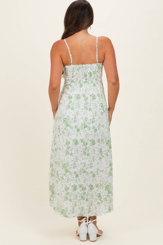 woman wearing a floral maternity maxi dress with straps and a smocked back, viewed from the back