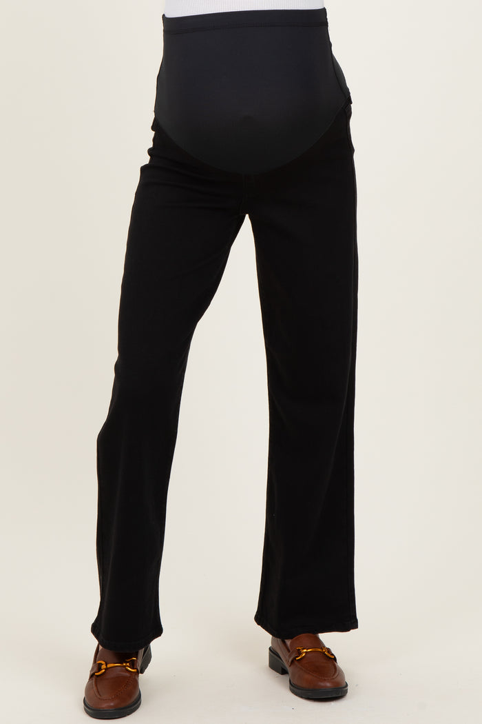 woman wearing black maternity pants with an over-the-bump waistband