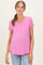 woman wearing a pink v-neck maternity top and showing her baby bump