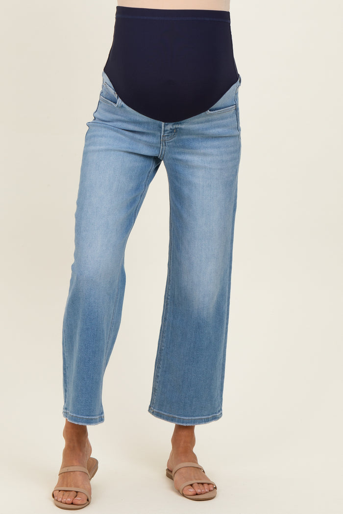 woman wearing light blue maternity wide-leg jeans with a dark blue over-the-bump panel