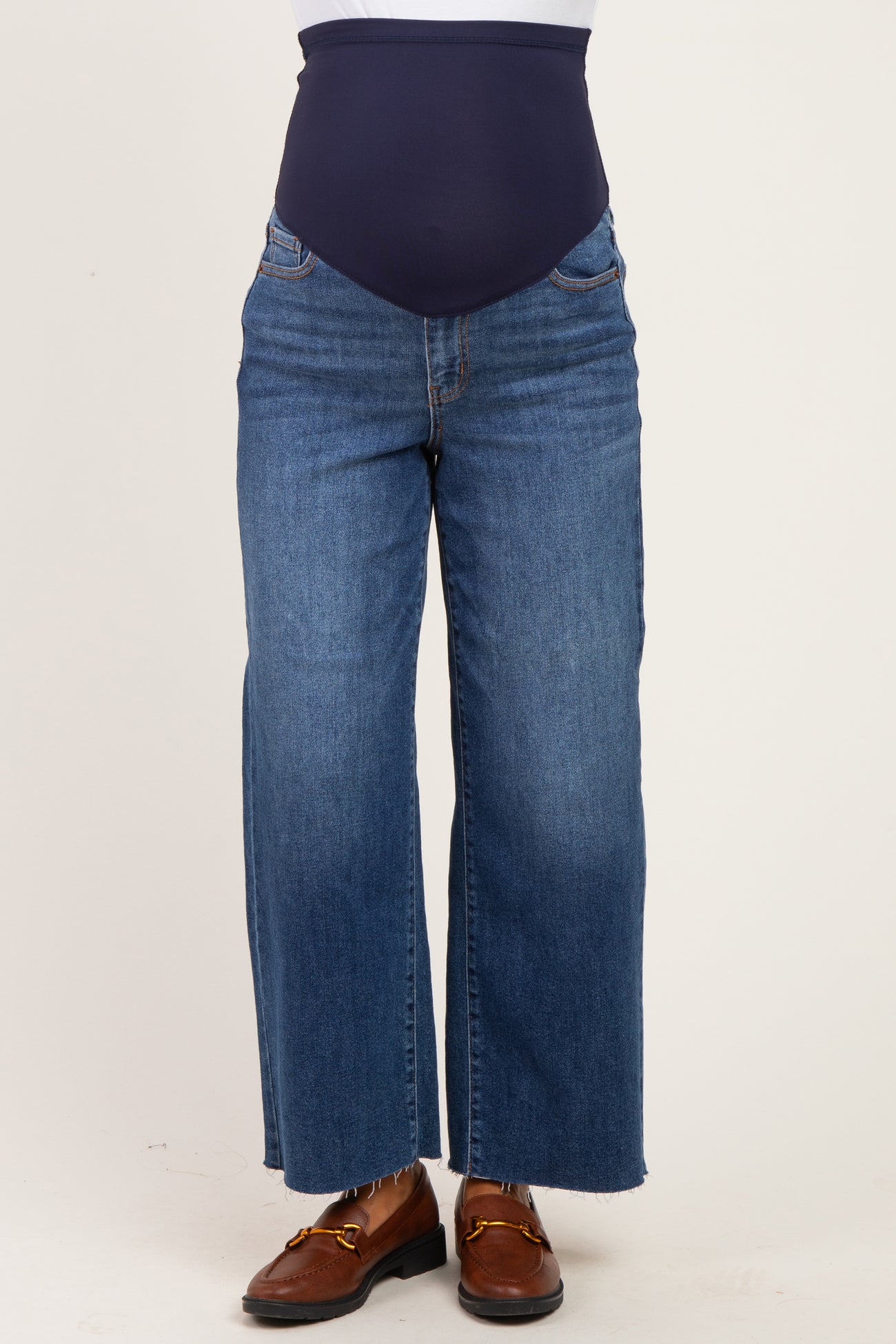 maternity wear dark blue wide leg jeans with a high waistband, model wearing brown shoes