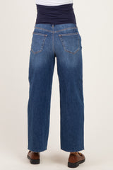 back view of a woman wearing maternity blue wide-leg jeans with a stretchy waistband and a loose fit