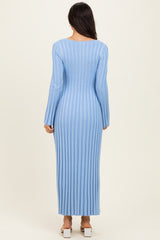 woman wearing a long sleeve light blue ribbed maxi dress, shown from the back