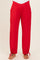 woman wearing red maternity pants with a crossover waistband and drawstring hems