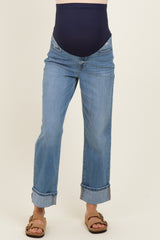 woman wearing blue maternity jeans with a navy belly panel and rolled cuffs