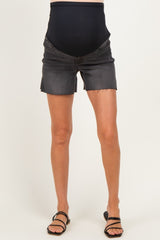 woman wearing black maternity shorts with a stretchy belly panel and frayed hem