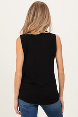 woman wearing a black sleeveless maternity top with a rounded hem and back view