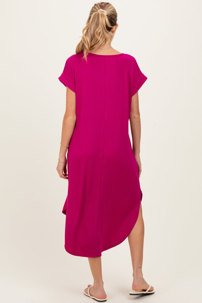 woman wearing a hot pink maternity midi dress with short sleeves and a slit on the side