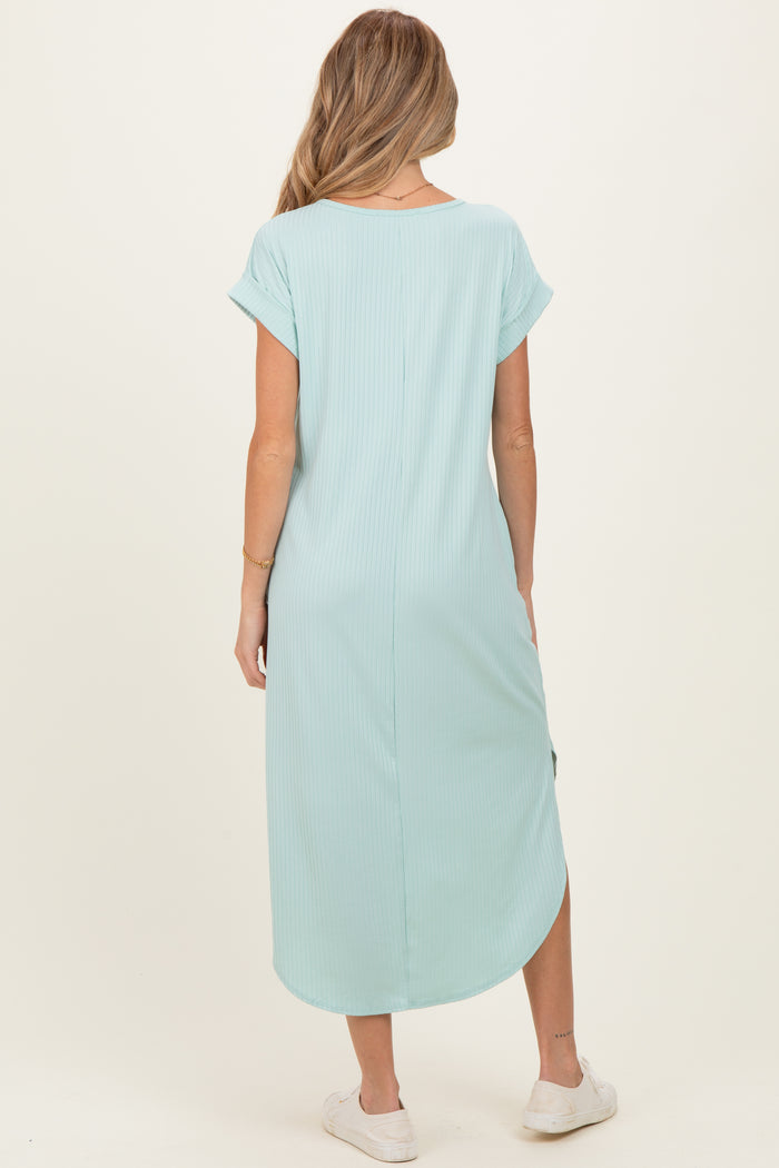 woman wearing a mint green maternity maxi dress with short sleeves and side slits, showing her back