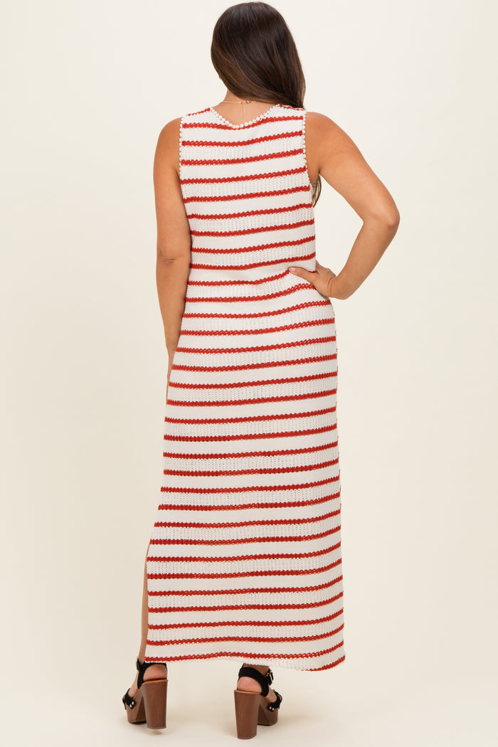 woman wearing a red and white striped maternity maxi dress with a side slit, showcasing her baby bump from the back