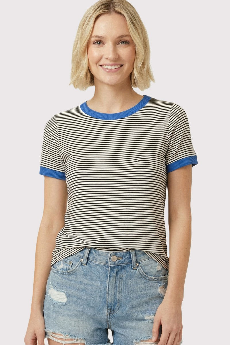 woman wearing a striped short sleeve t-shirt with blue ribbed neckline and cuffs, paired with denim shorts