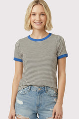 woman wearing a striped short sleeve t-shirt with blue ribbed neckline and cuffs, paired with denim shorts