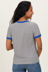 woman wearing a striped maternity t-shirt with blue ribbed trim on the sleeves, showing the back view