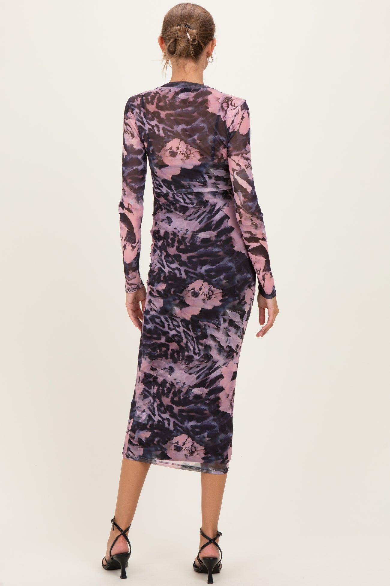 maternity wear long sleeve dress in pink and navy abstract print, model shown from the back