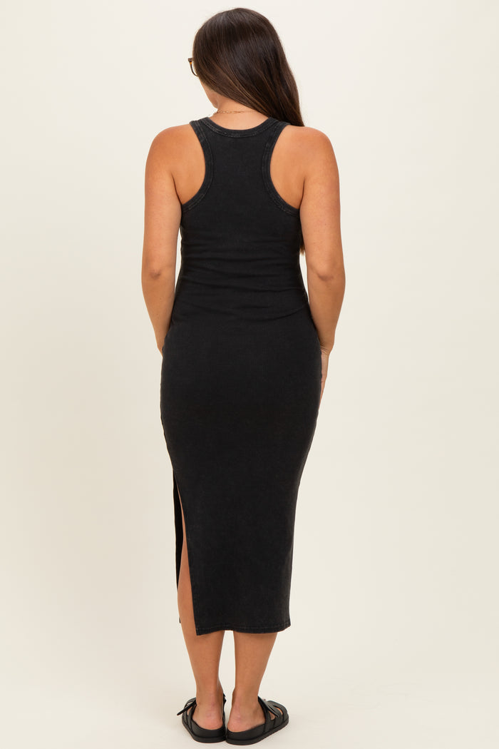 woman wearing a black ribbed maternity tank maxi dress with a side slit, showing her baby bump from the back
