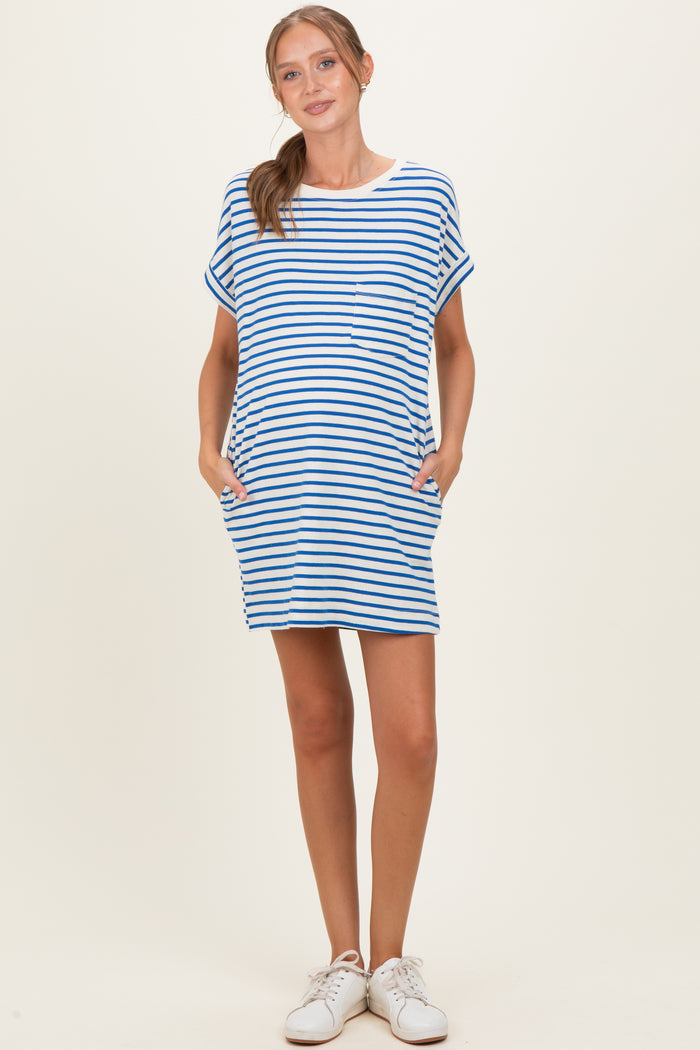 woman wearing a striped maternity dress with short sleeves and pockets, showing her baby bump