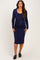 woman wearing a navy long sleeve maternity dress with a tie detail at the waist and showing her baby bump