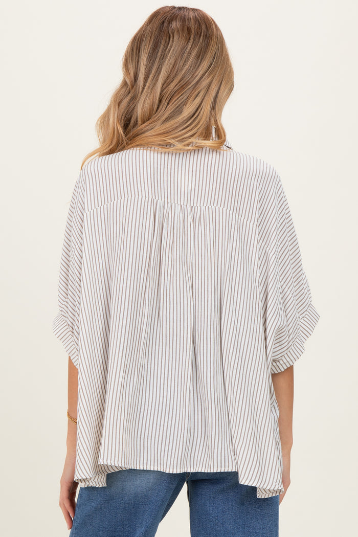 woman wearing a striped maternity top with loose fit and short sleeves, showing the back design