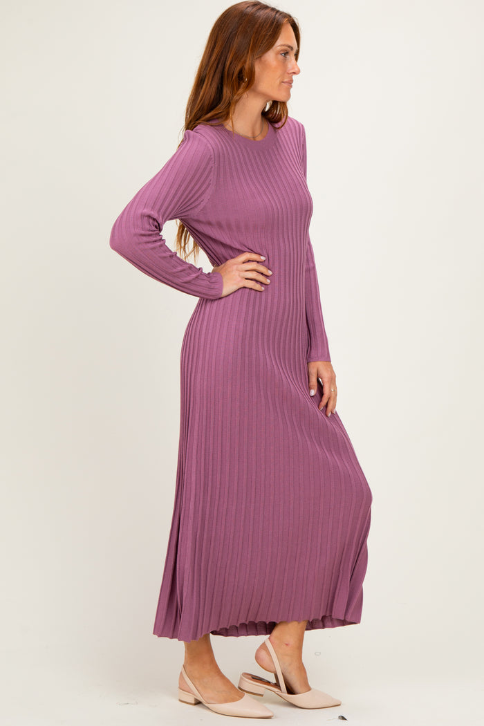 woman wearing a long sleeve ribbed maxi dress in mauve with a relaxed fit and side slits