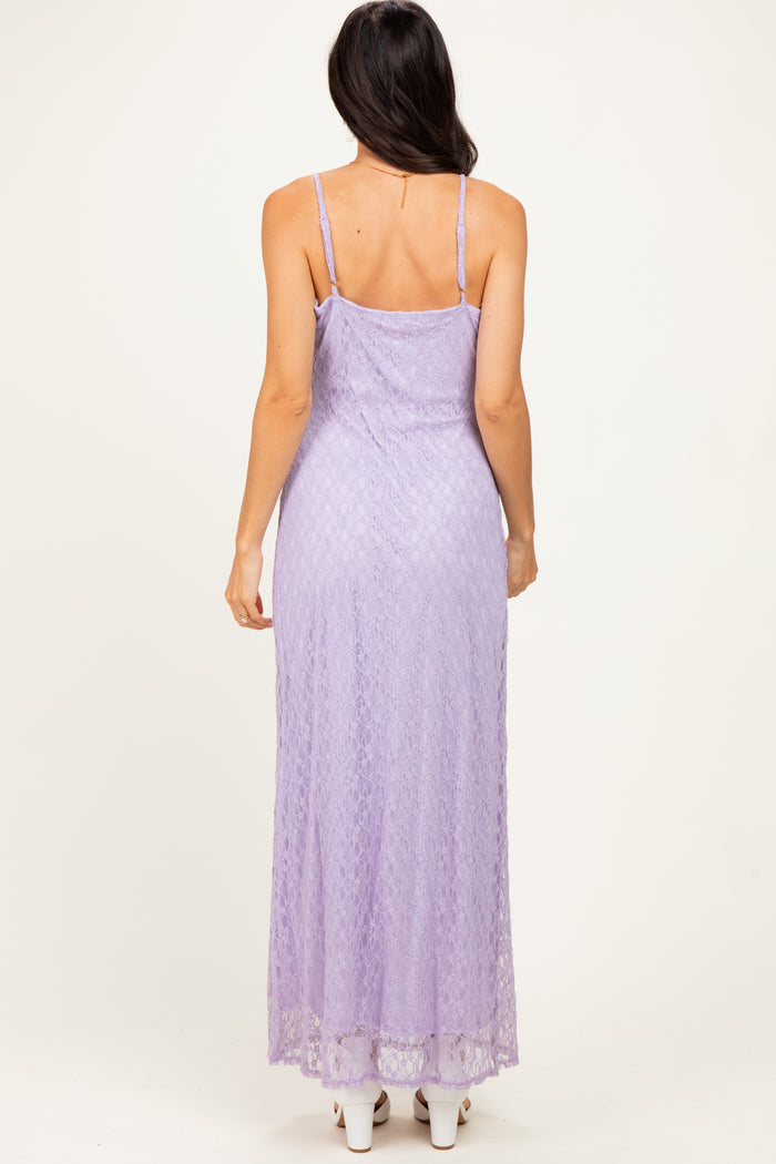 woman wearing a lavender lace maxi dress with spaghetti straps, showing a fitted silhouette from the back