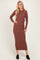 woman wearing a brown long sleeve ribbed maxi dress and black ankle boots