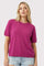 woman wearing a bright pink short sleeve knit sweater with a relaxed fit and casual style