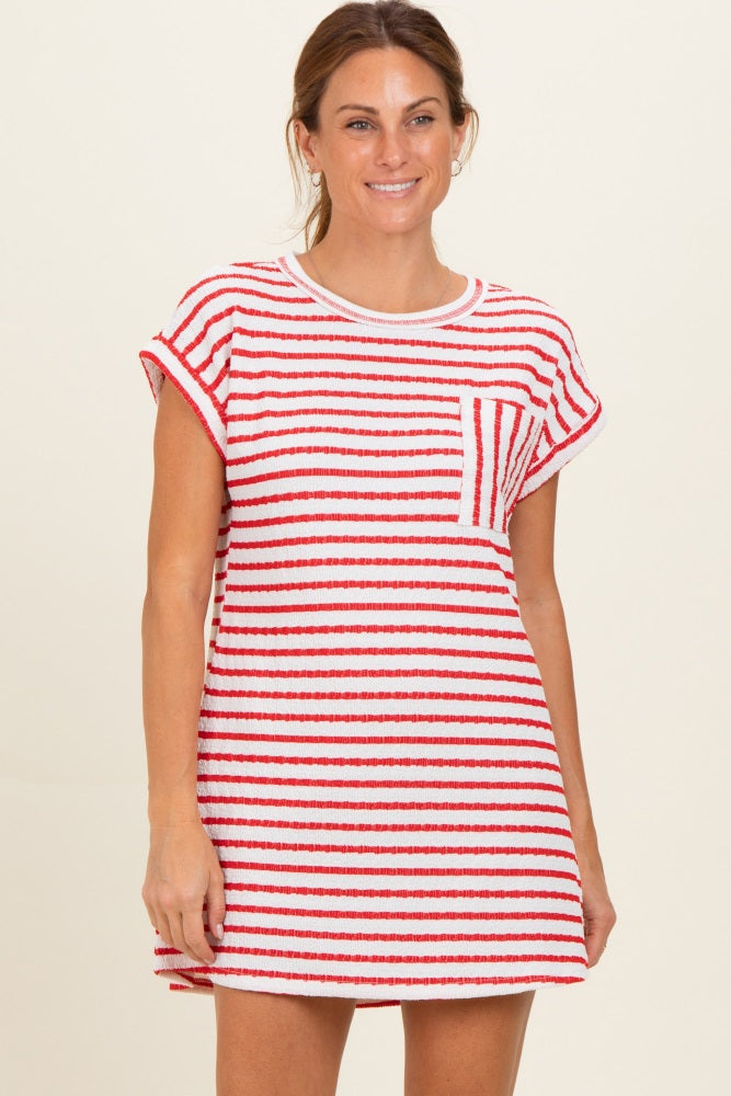 woman wearing a red and white striped short sleeve dress with a pocket on the chest