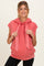 woman wearing a coral sleeveless hoodie with a kangaroo pocket and drawstring ties, showcasing her baby bump