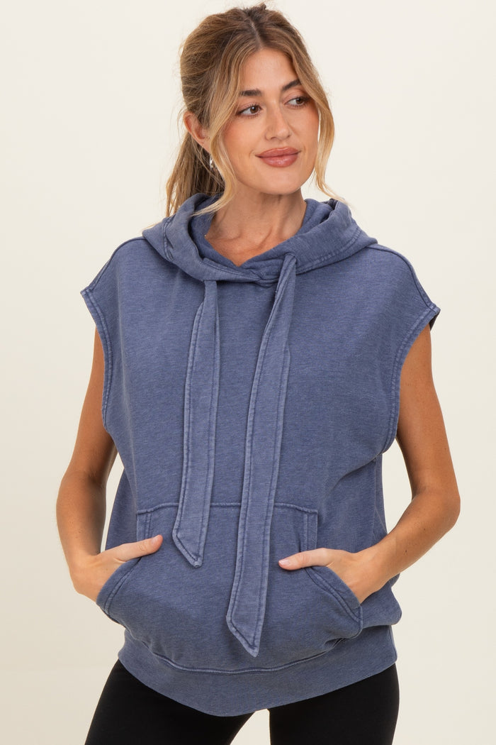 woman wearing a navy blue sleeveless hoodie with a drawstring and front pockets, maternity wear