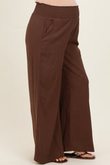 maternity wear brown wide-leg pants with a stretchy smocked waistband and side pockets