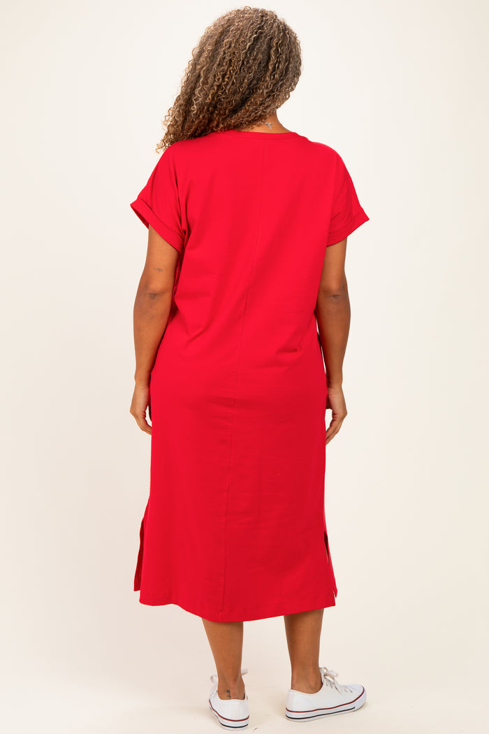 woman wearing a red plus size dress with short sleeves and side slits, viewed from the back