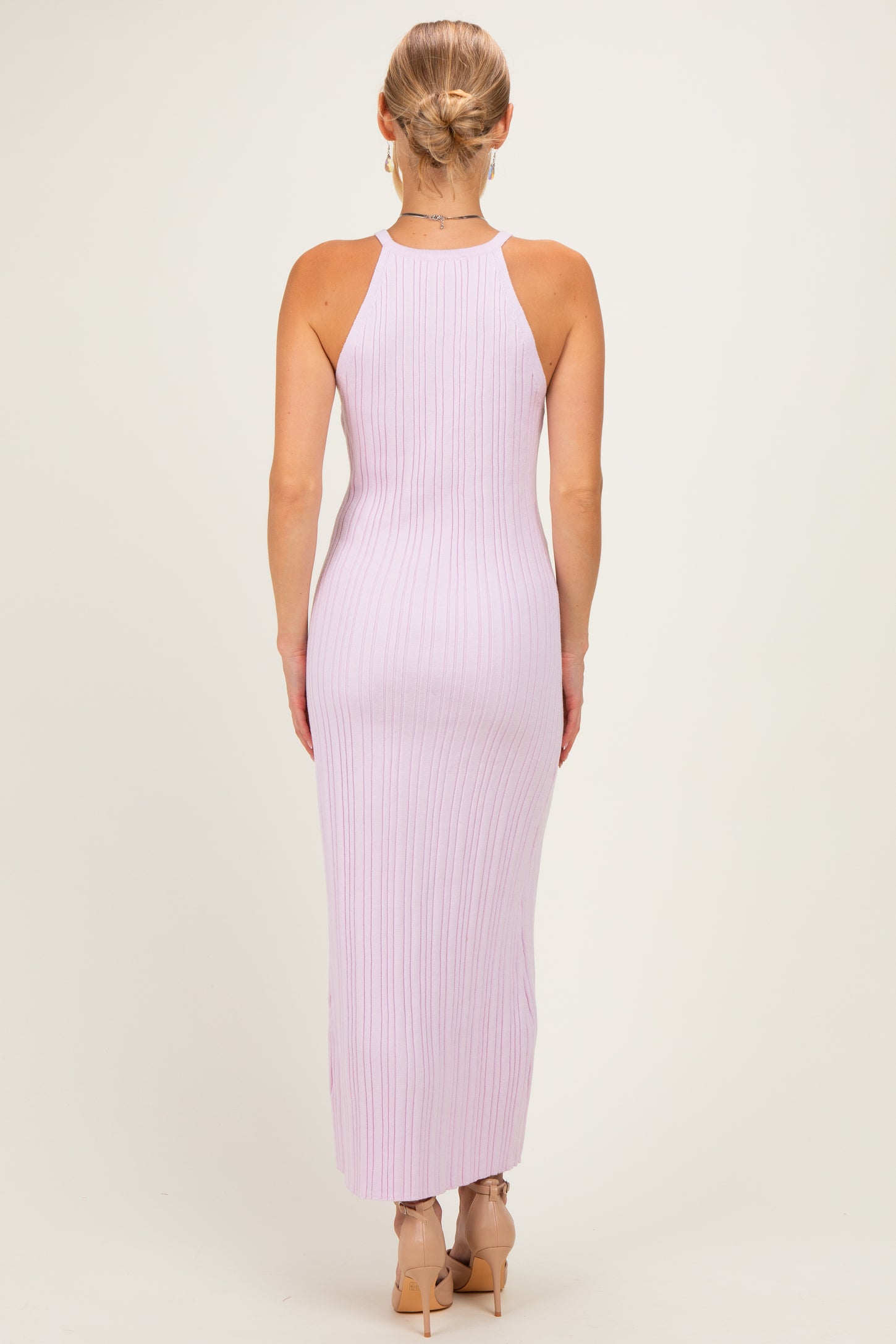woman wearing a light lavender ribbed sleeveless maxi dress, showing the back view