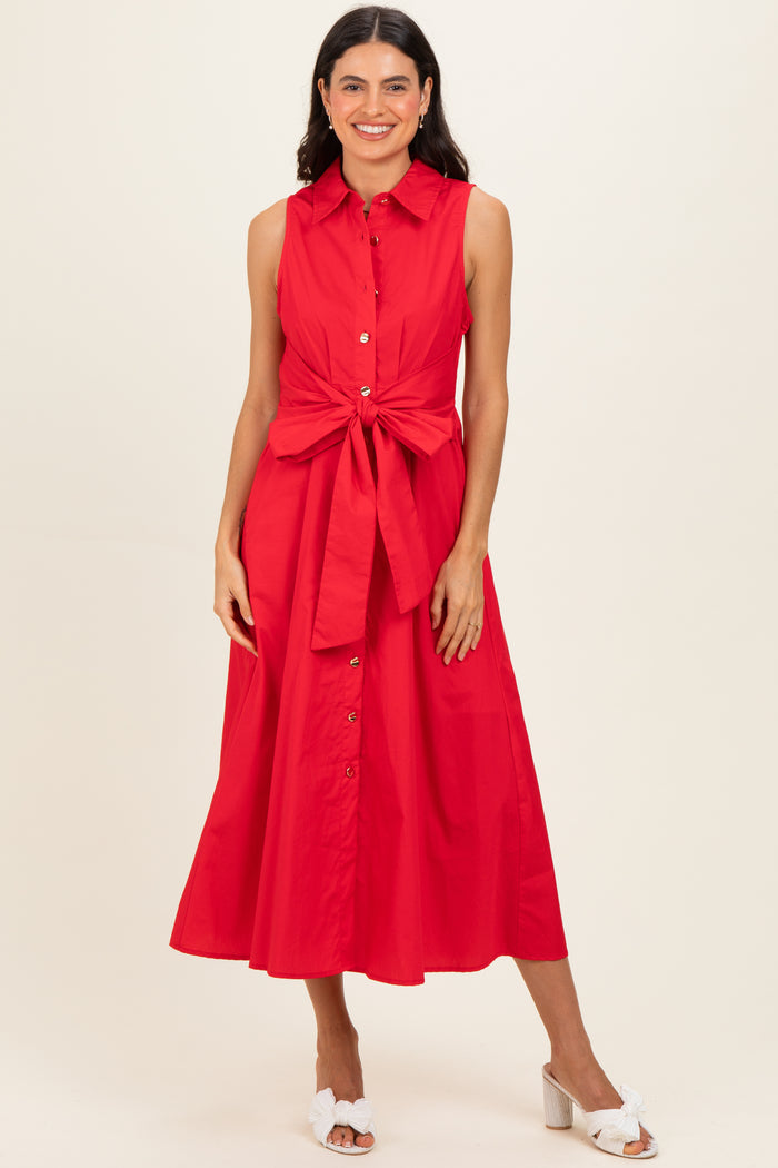 woman wearing a red sleeveless button-up midi dress with a tie waist detail