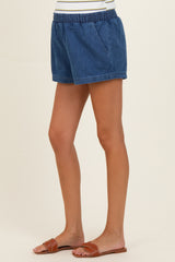 woman wearing denim maternity shorts with an elastic waistband and side pockets