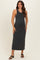 woman wearing a dark gray sleeveless maternity maxi dress with a fitted silhouette and a baby bump visible