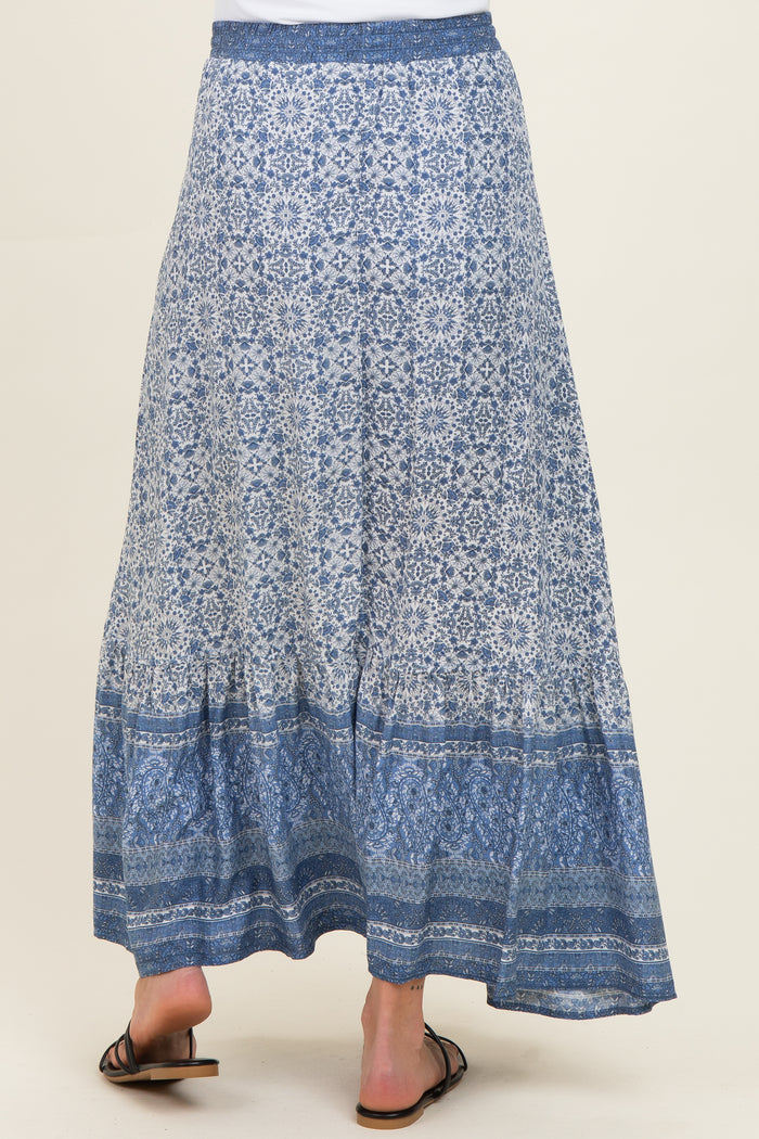 maternity wear blue patterned maxi skirt with a tiered hem, model seen from the back
