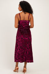 woman wearing a burgundy floral velvet midi dress with spaghetti straps, shown from the back