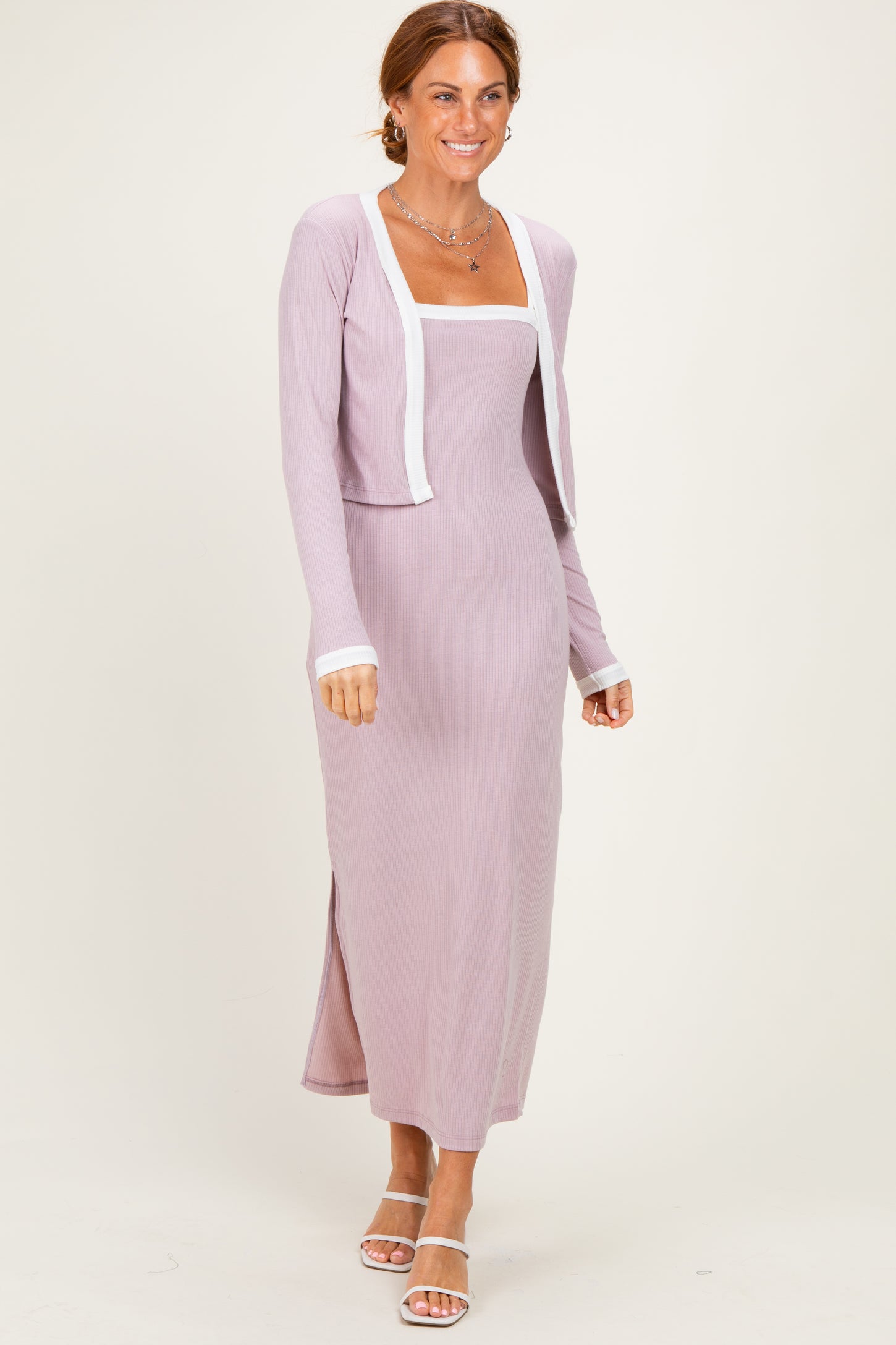 woman wearing a lavender ribbed maxi dress with a square neckline and a matching cropped cardigan